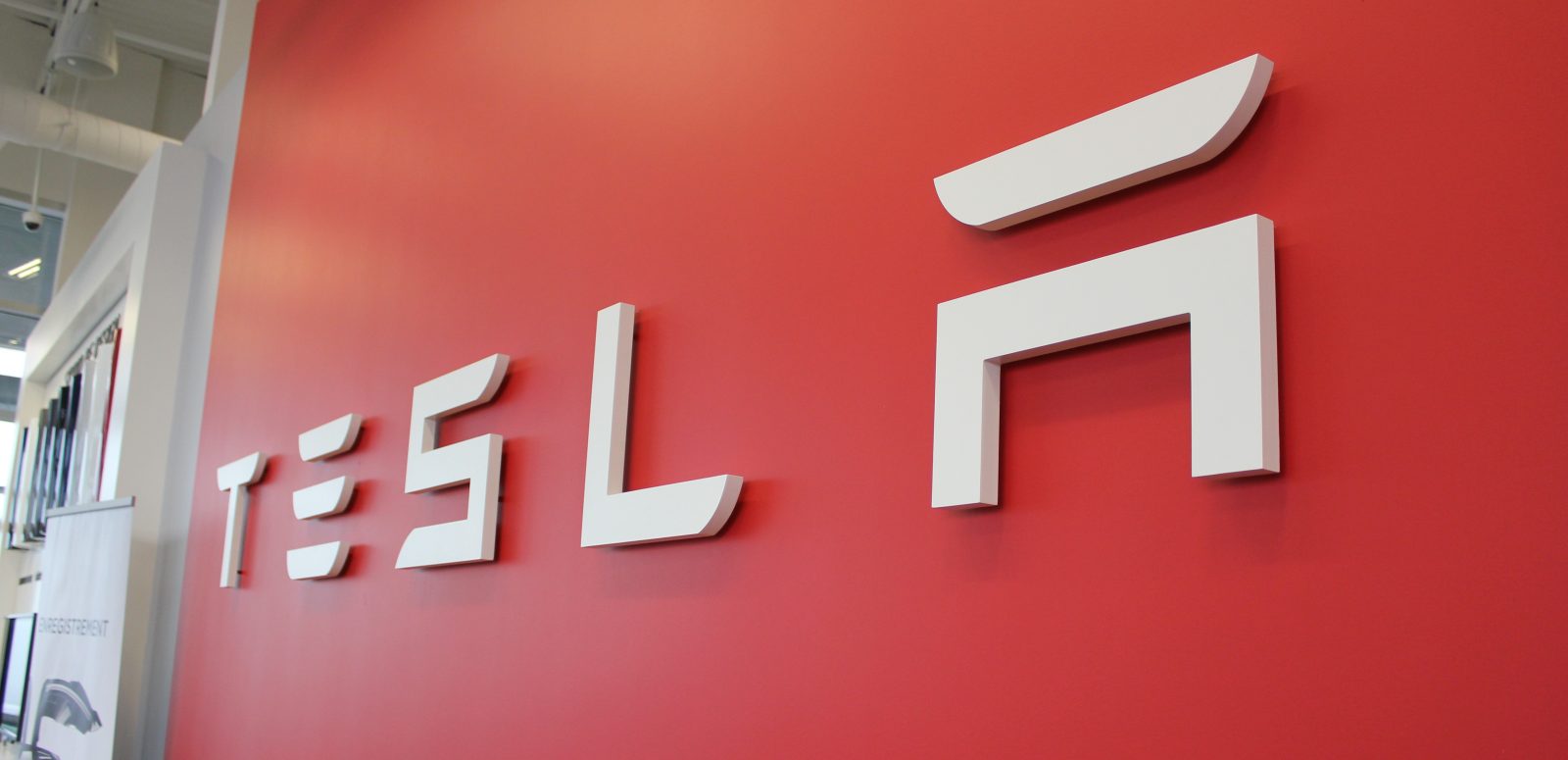 photo of Tesla (TSLA) stock falls on demand concern from analyst, continued trade war issues image