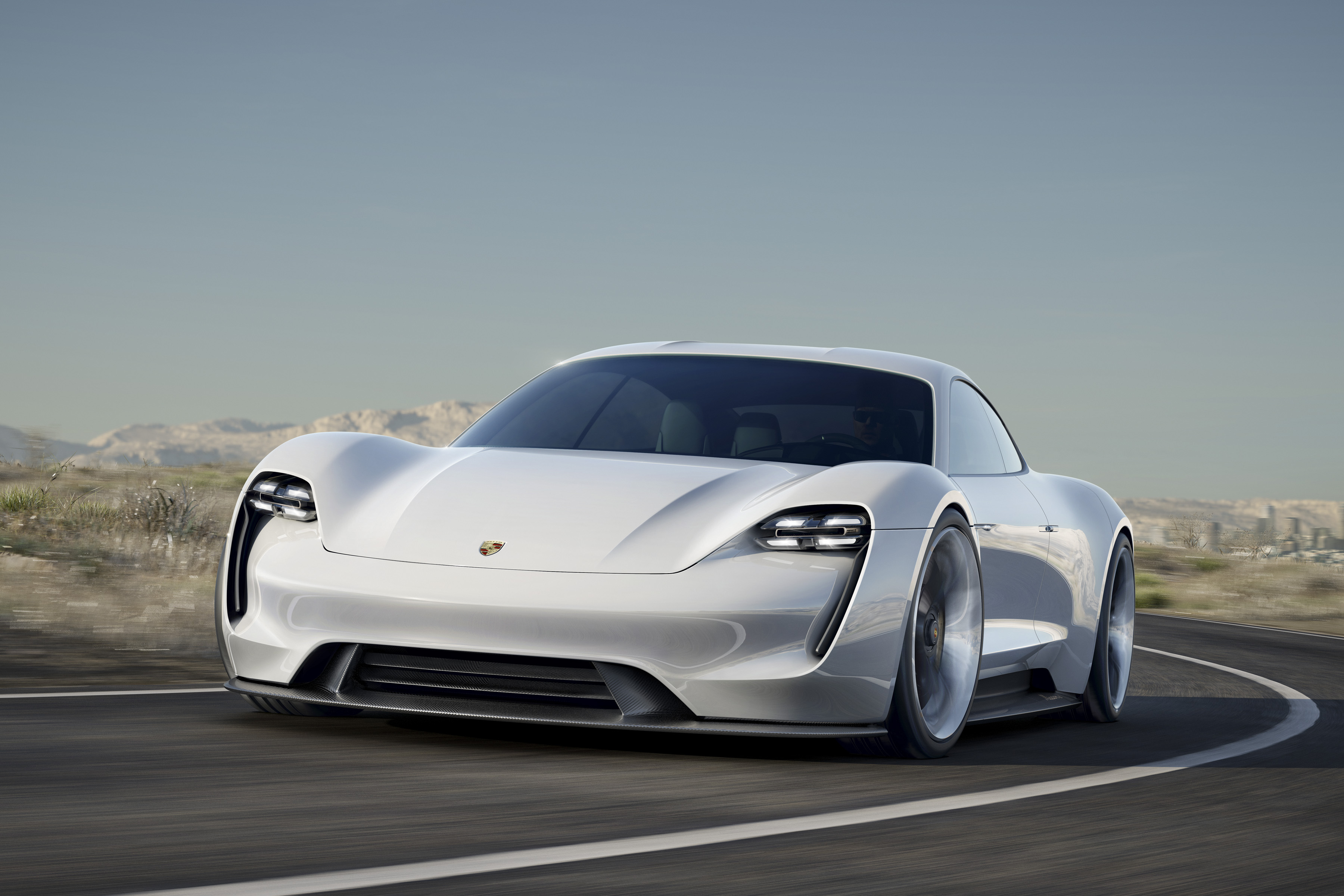 Porsche changes its mind on electric vehicles, plans 50 of its