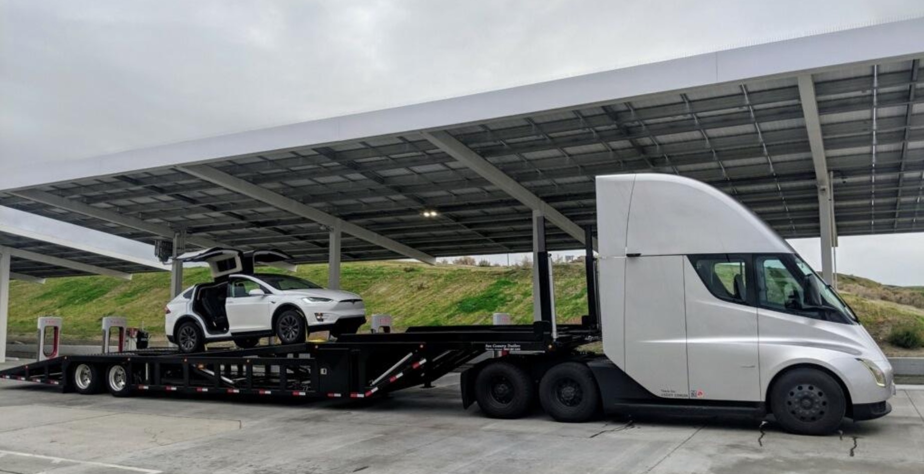 Tesla is buying car hauling  trucks  and trailers  using 13 