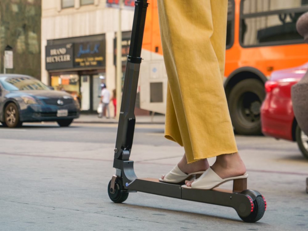 electric scooter unveiled mounts to and charges in car