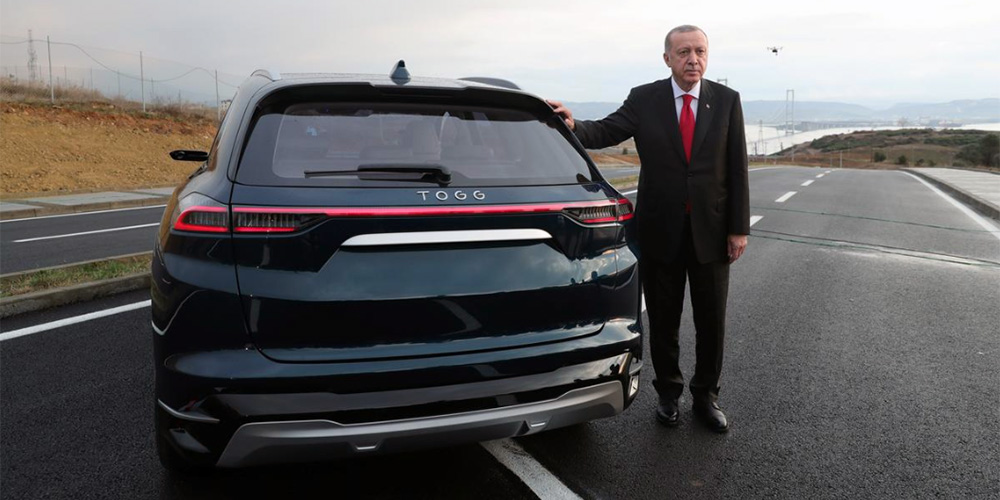 Turkish President Recep Tayyip Erdogan with an electric vehicle