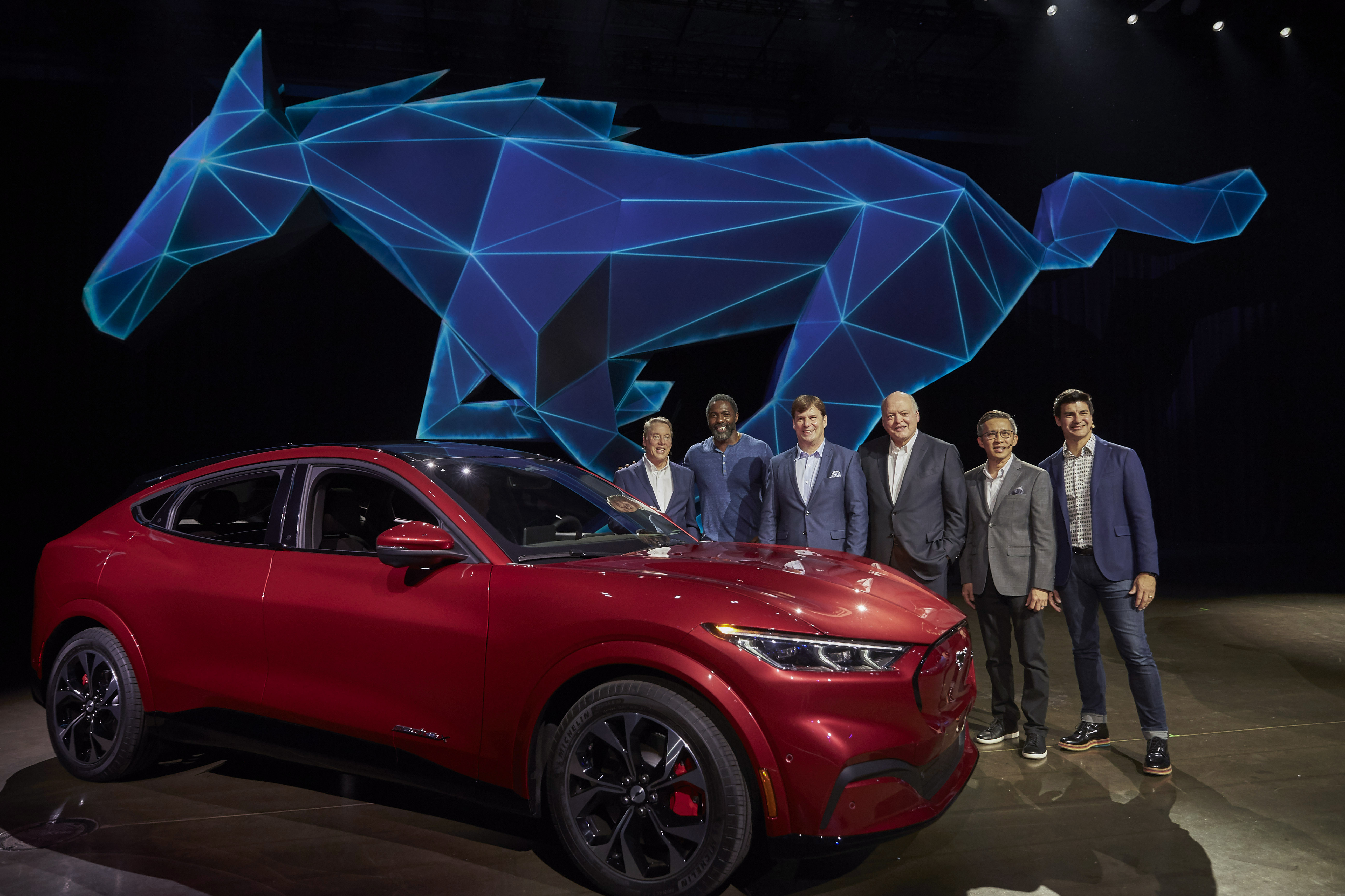 From left, Ford Executive Chairman Bill Ford, actor Idris Elba, COO Jim Farley, CEO Jim Hackett, Ford Chief Product Development Officer Hau-Thai Tang and Director for Global Electrification Ted Cannis at the reveal of the all-electric Ford Mustang Mach-E.