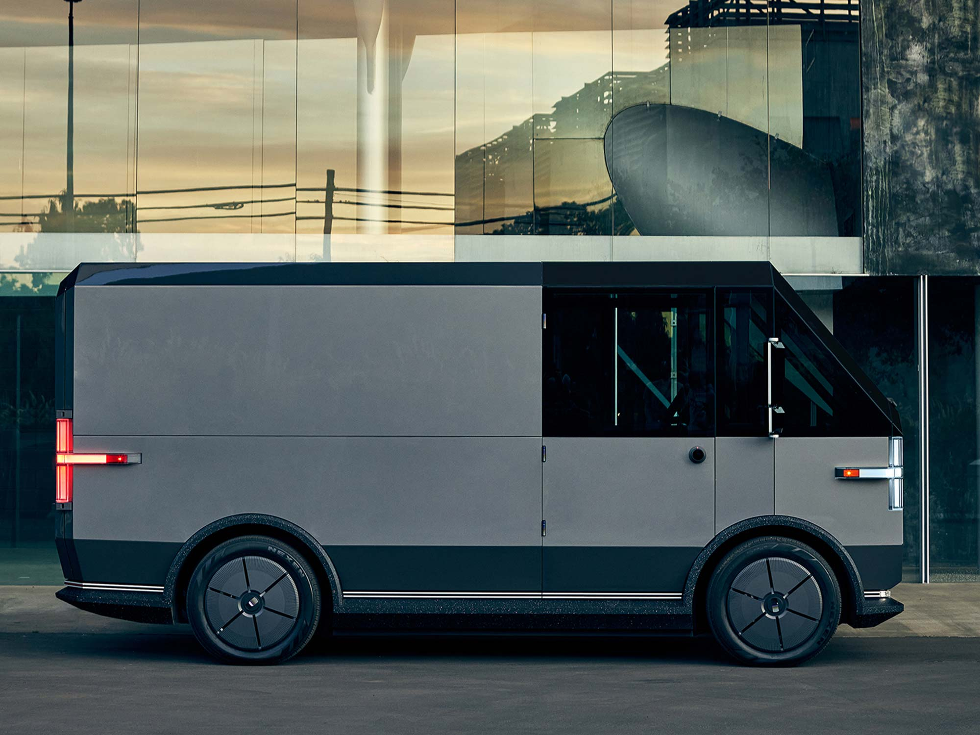Canoo unveils $33,000 electric delivery van, teases electric pickup ...