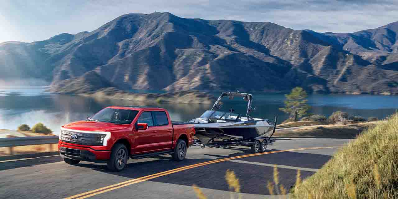 Ford F 150 Lightning deliveries Towing Boat