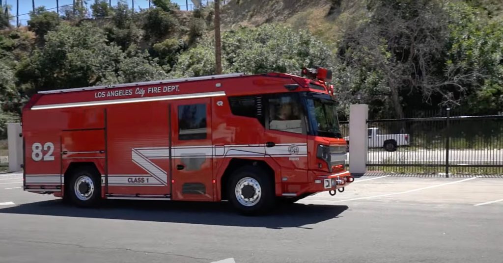 Los Angeles City Fire Department engine pumping water at a night