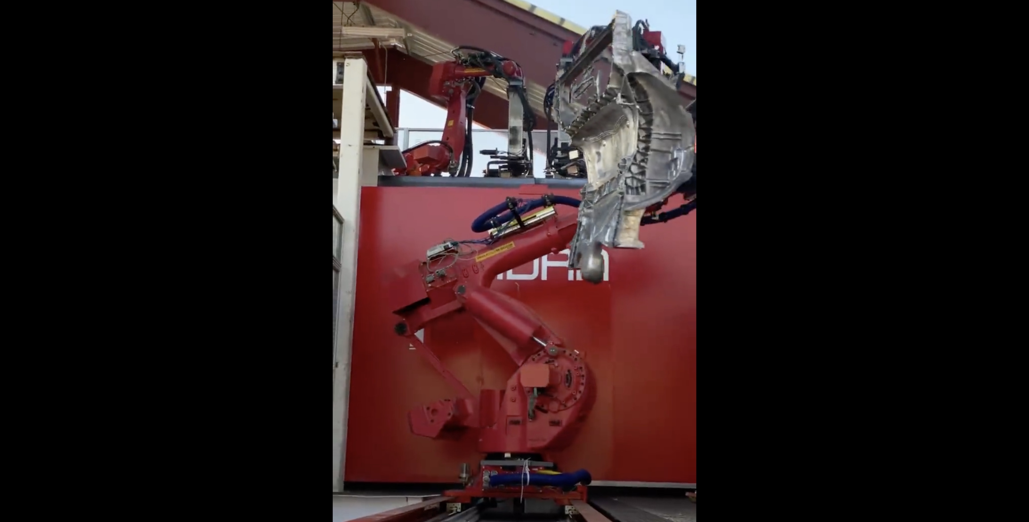 Tesla Releases Impressive Footage Of Robot Pulling Still Smoking Casting From Giga Press Electrek