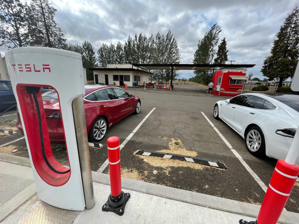 electric roadtrip supercharger in an old gas station