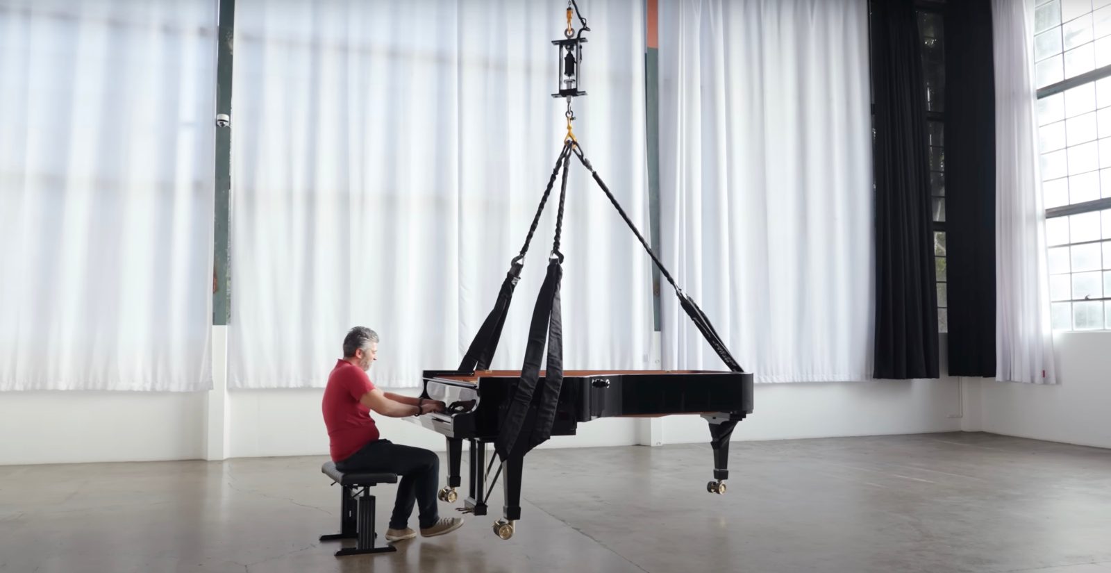 Tesla Bot Actuator lifts piano