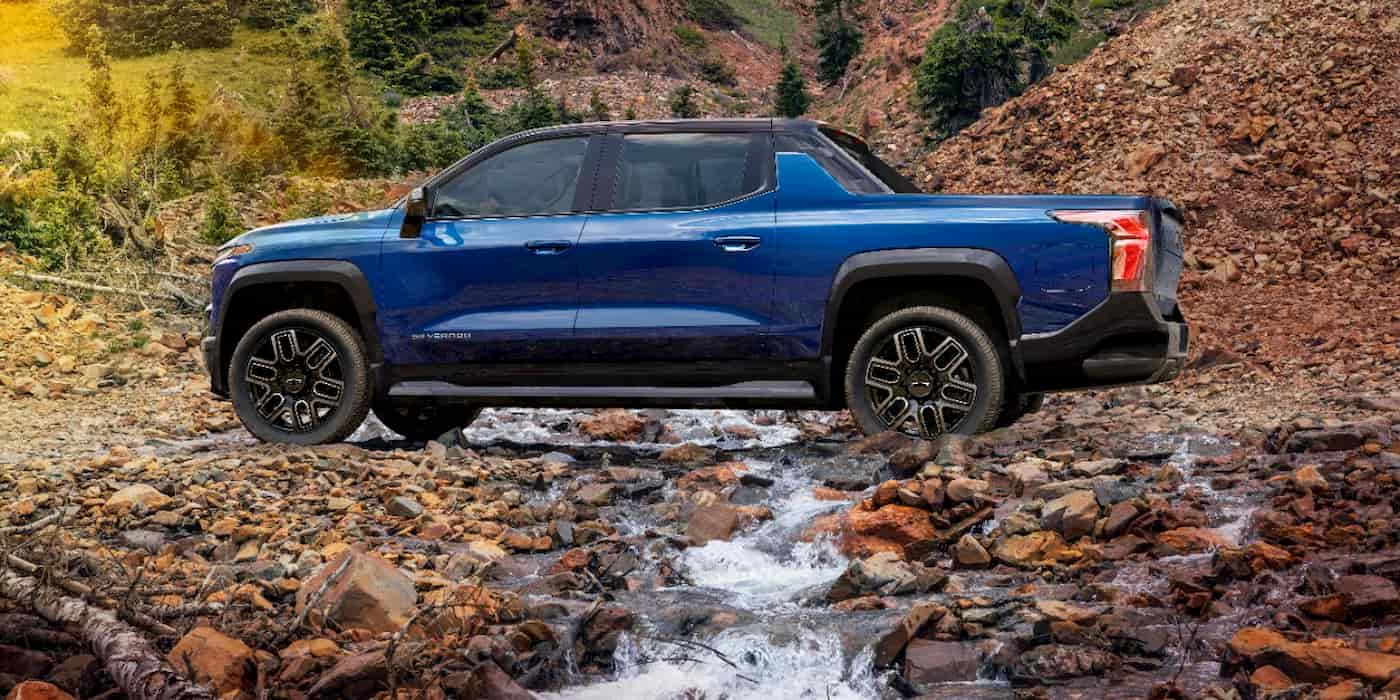 A blue truck crossing a rocky river

AI-generated content may be incorrect.