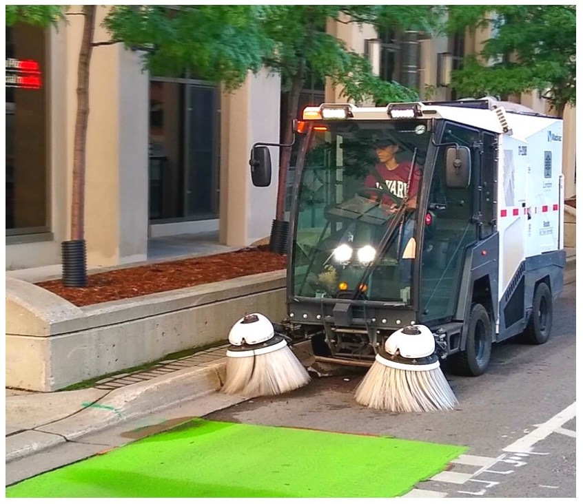 This cute electric mini-street sweeper is enabling safer bike lanes
