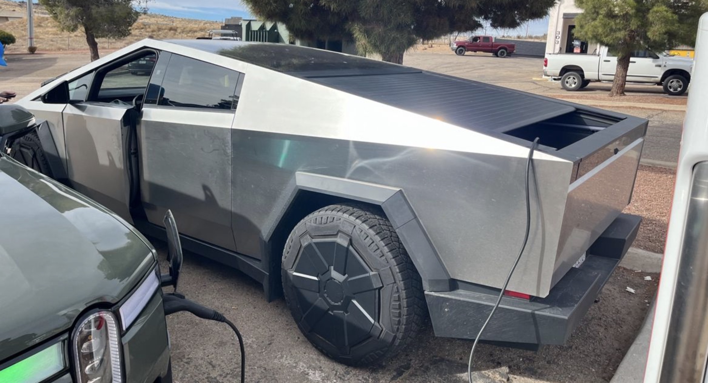 Tesla Cybertruck Spotted Charging Rivian R1T Electric Pickup Truck ...