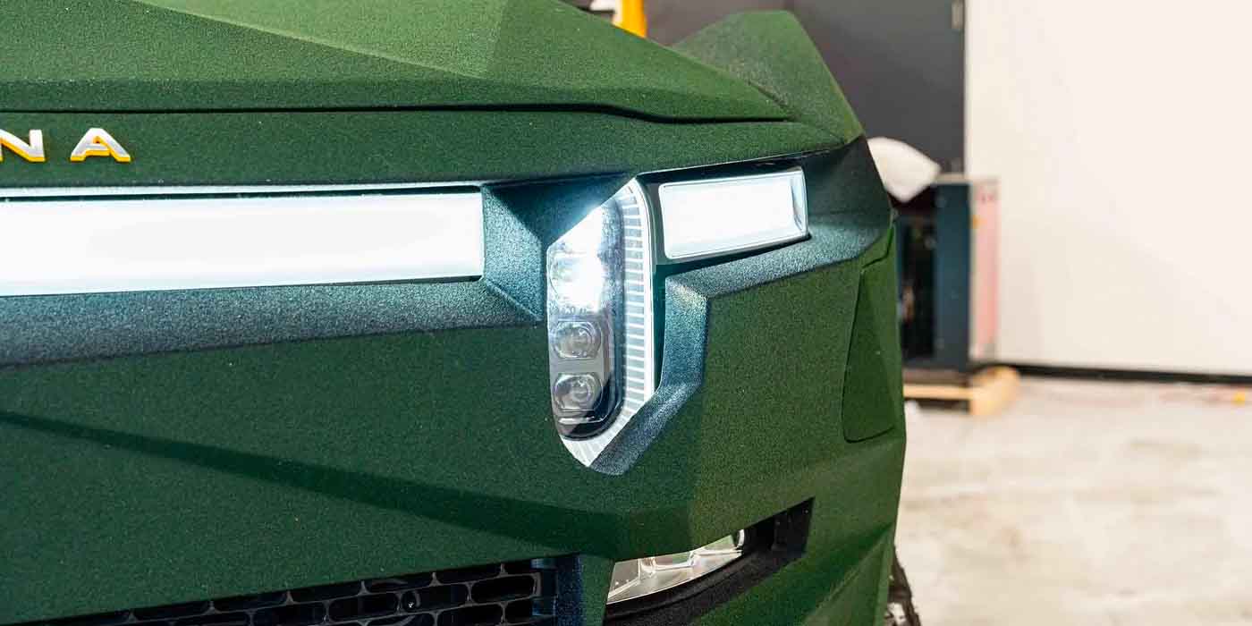 This custom Rivian has been fit with a lift kit, kevlar paint, roll cage
