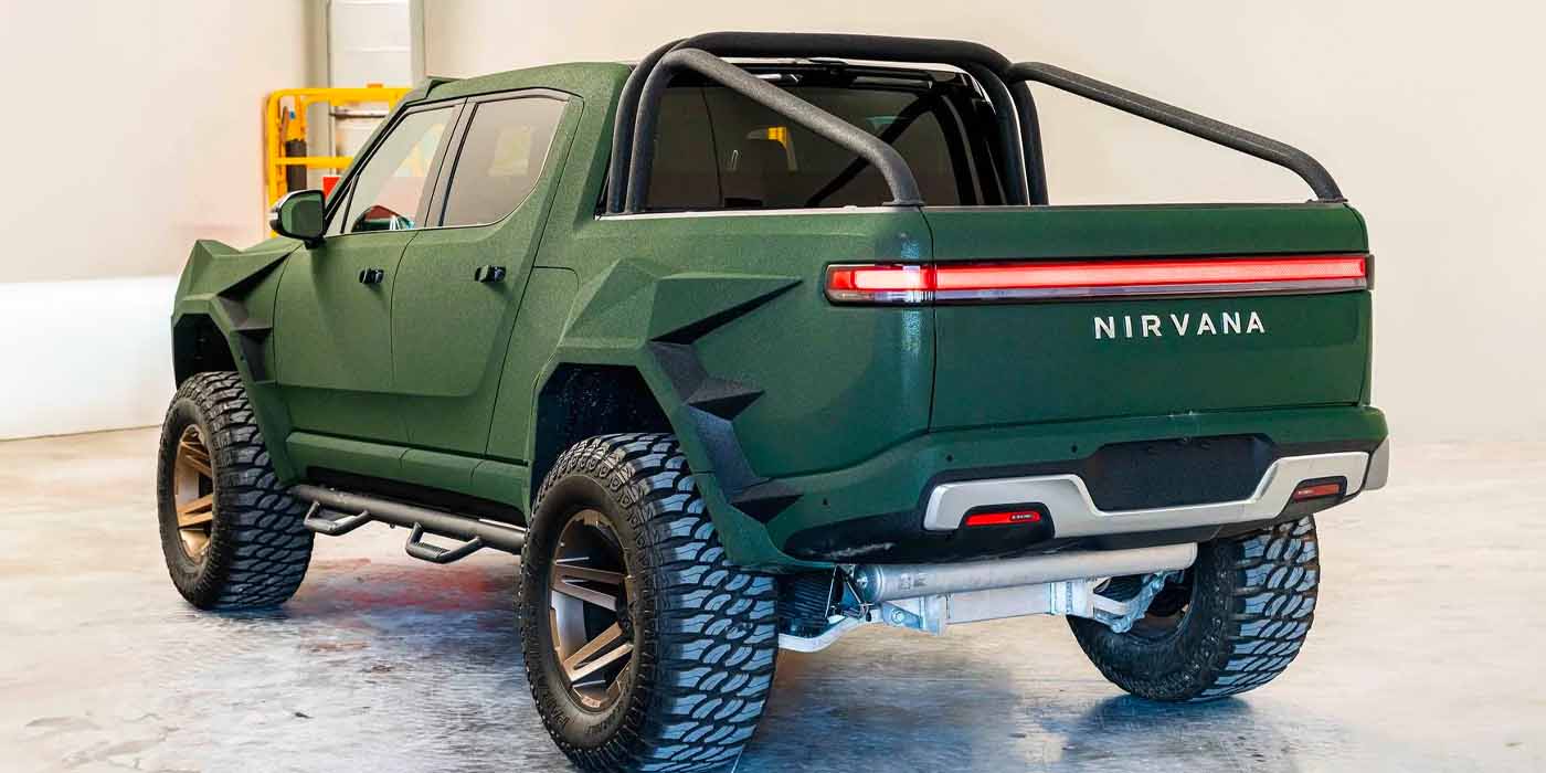 This custom Rivian has been fit with a lift kit, kevlar paint, roll cage