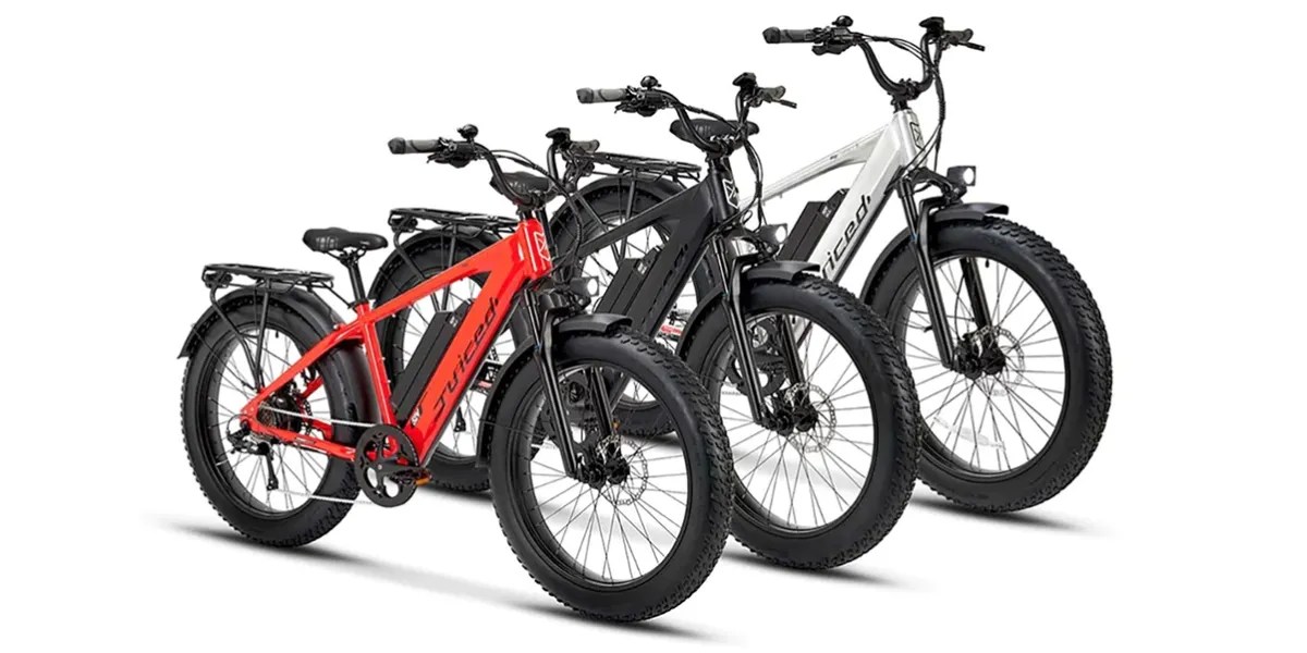 Three of Juiced Bikes' RipCurrent S Fat-Tire e-bikes next to one another facing at an angle against a white backdrop within post about WORX Aventon e-bike