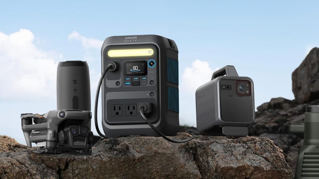 Anker SOLIX C300X power station charging drone and projector on rocks