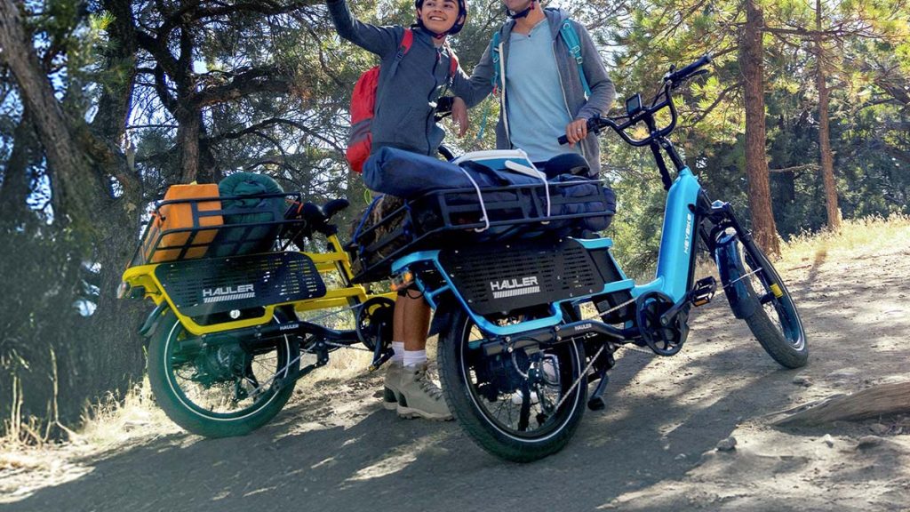 father and son on trail with Heybike hauler e-bikes