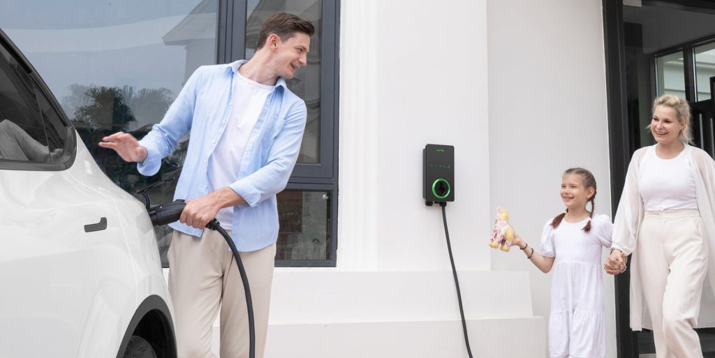 man charging vehicle with Autel EV charger