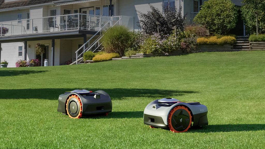 Segway navimow robot lawn mowers in grass in front of home