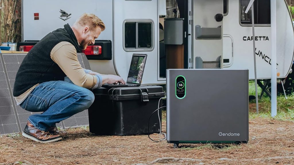 Gendome Home3000 Power Station being used to power laptop in front of camper