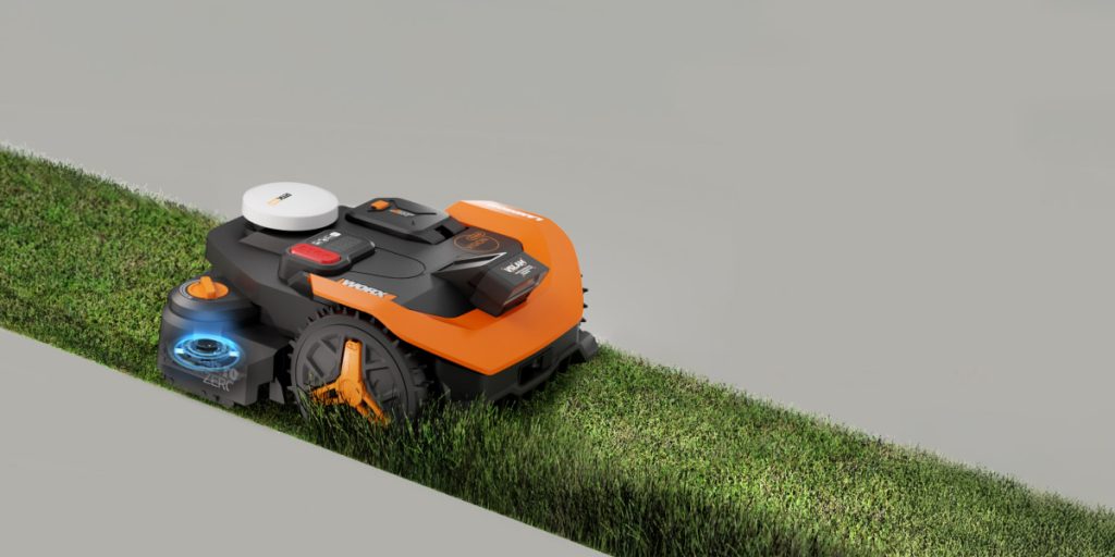 Worx robot lawn mower on strip of grass