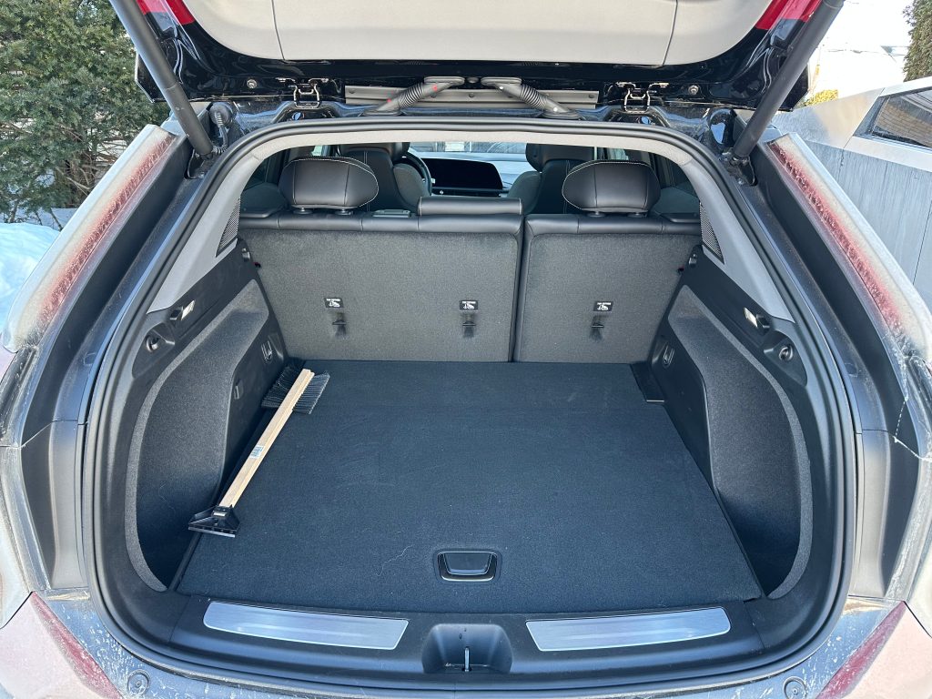 Trunk Floor is high, and the hidden compartment is rather small, just enough for the portable EVSE