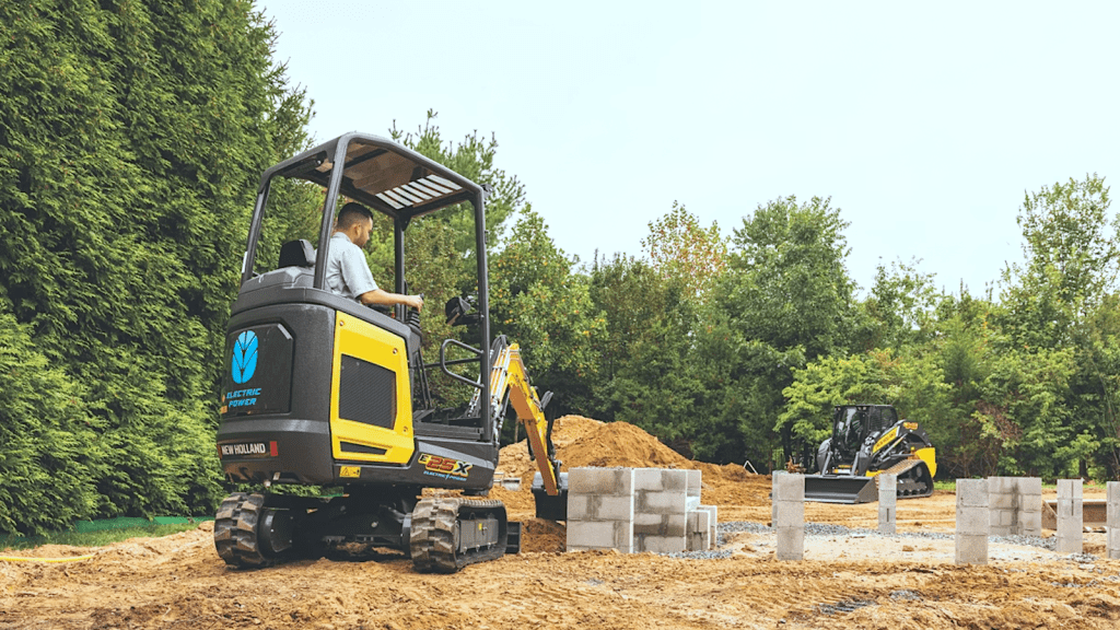 ABOVE: The New Holland Construction E25X electric mini excavator and C314X electric mini track loader working together on a construction site — a combination New Holland says is suited to noise- and emissions-sensitive environments
