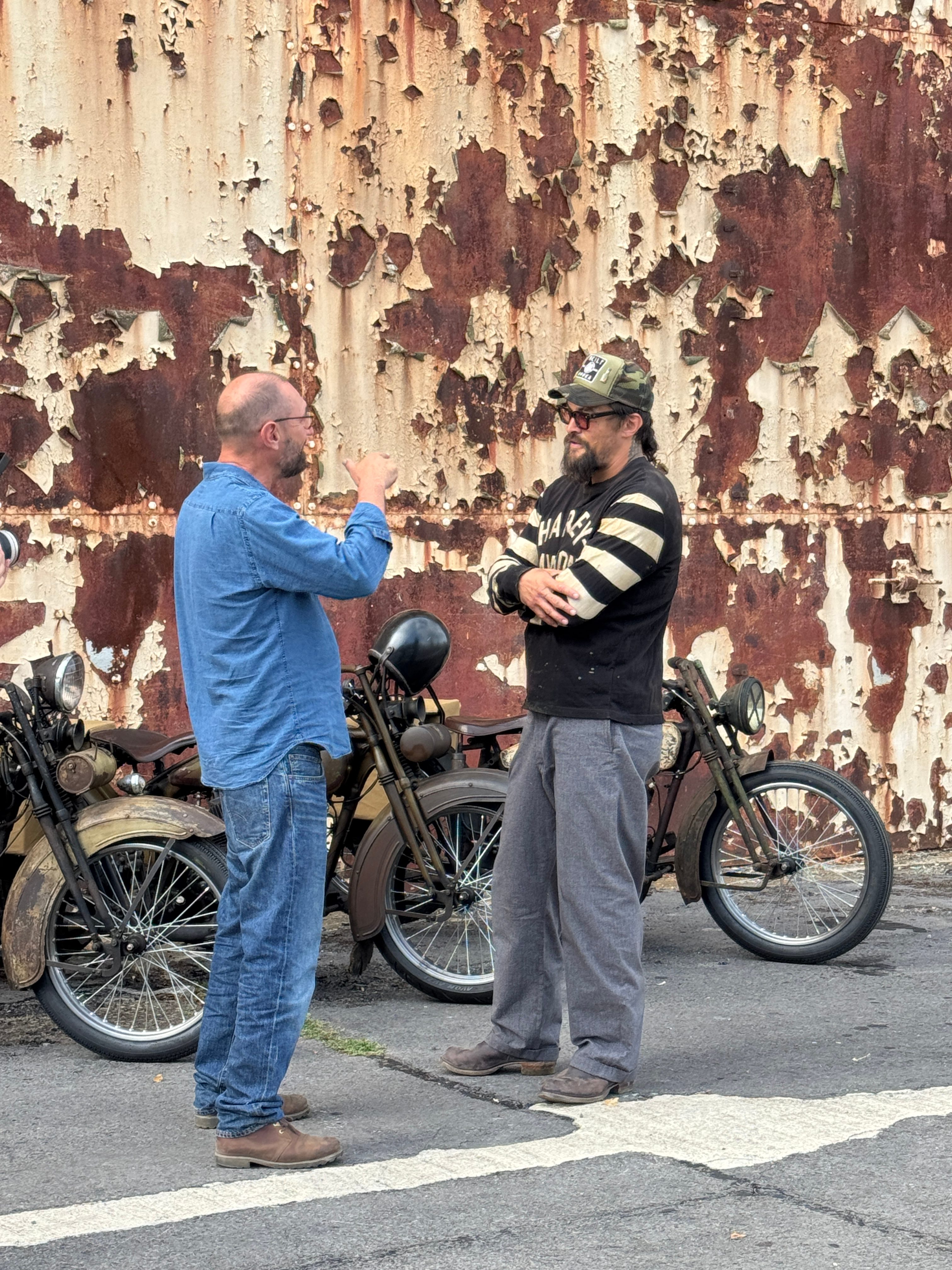 Jason Momoa with Electrogenic CEO Steve Drummond and the converted 1920s Harley-Davidson motorcycles