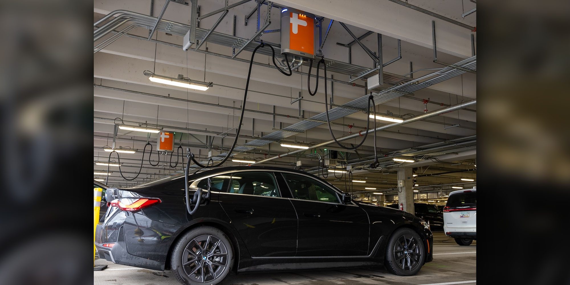 Portland airport can charge 20 rental EVs at once – from overhead
