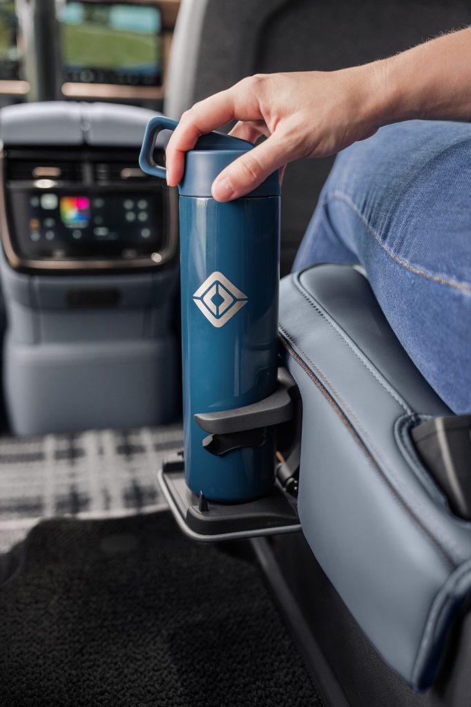 Push-to-release cup holder on the 2027 Rivian R1S captain's chair