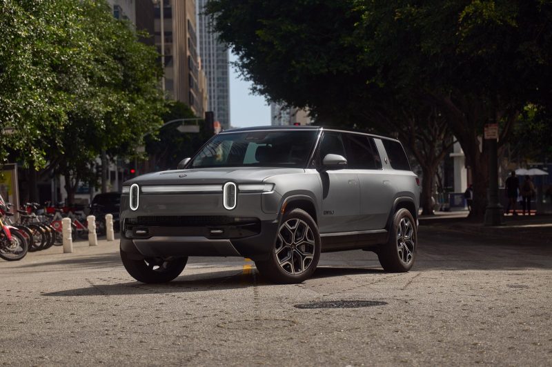 2027 Rivian R1S in Esker Silver on a city street