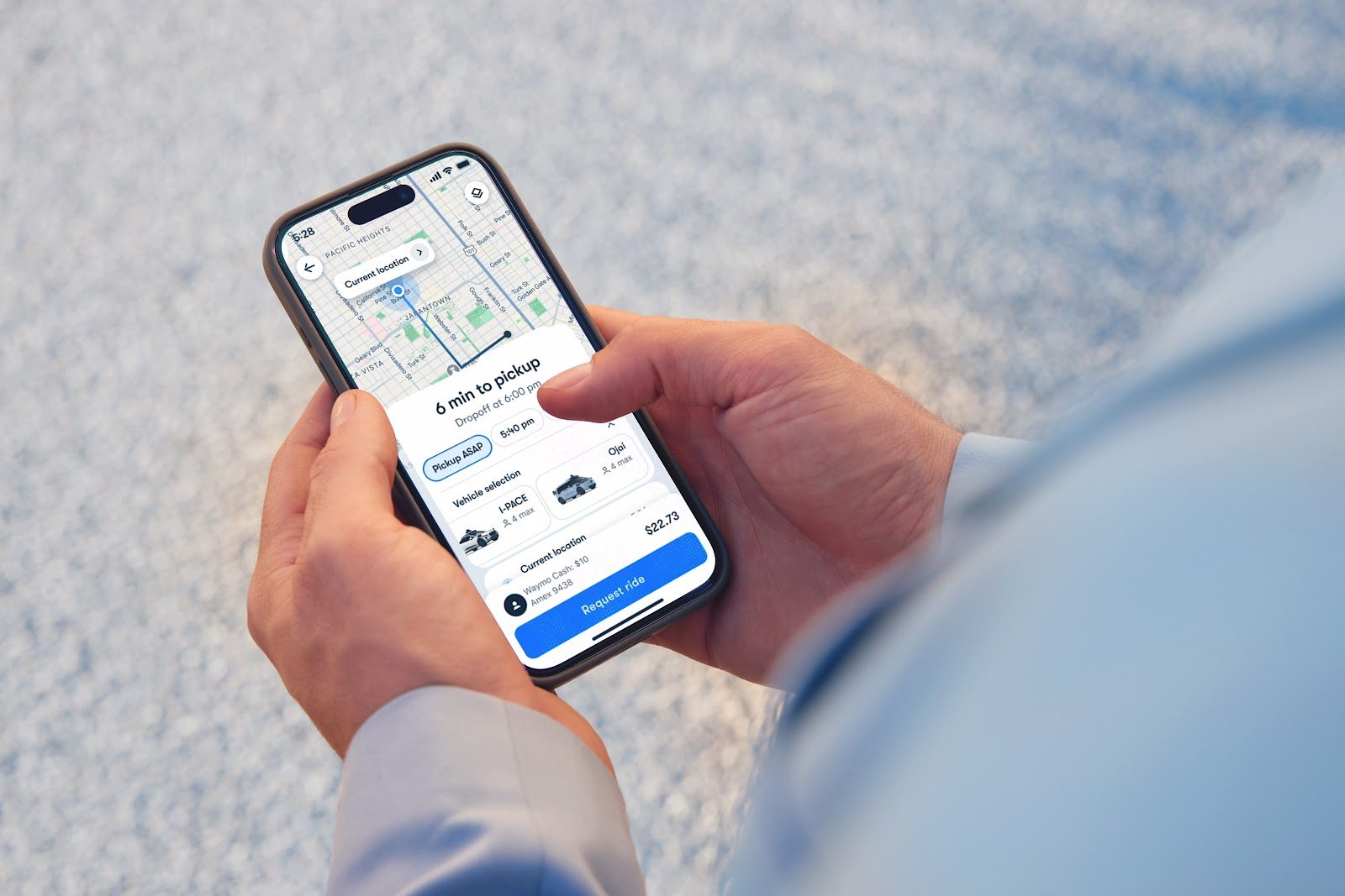 Waymo redesigned rider app shown on a phone