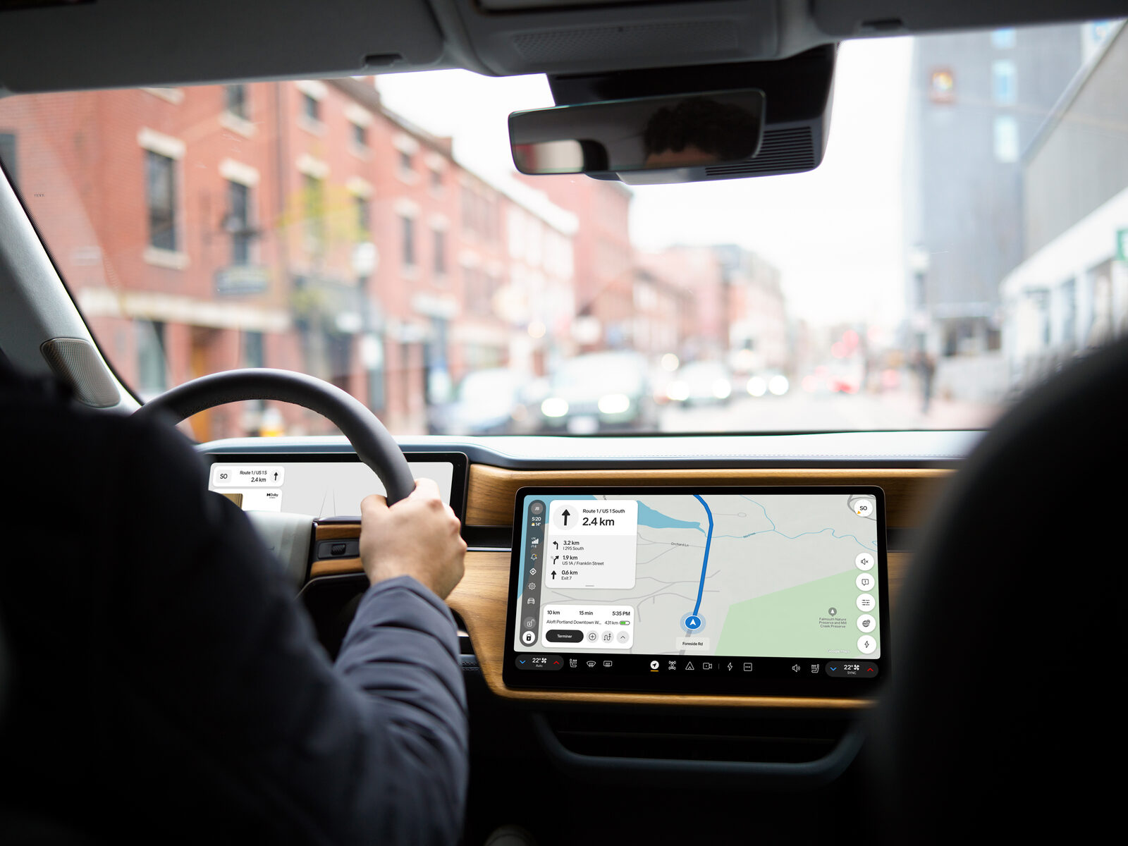 Rivian center display showing navigation in RivianOS 2 while driving