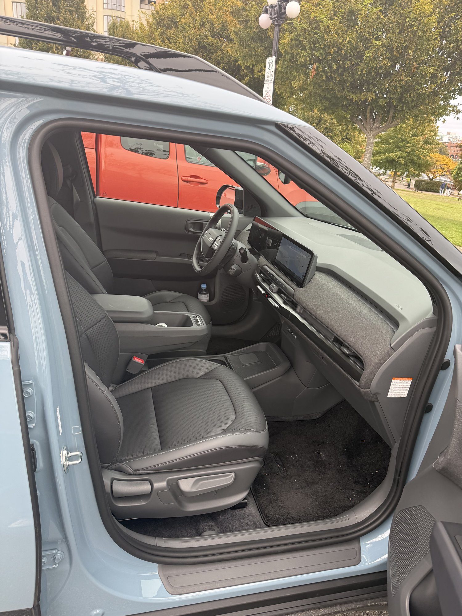 Kia EV3 interior seen from the driver door