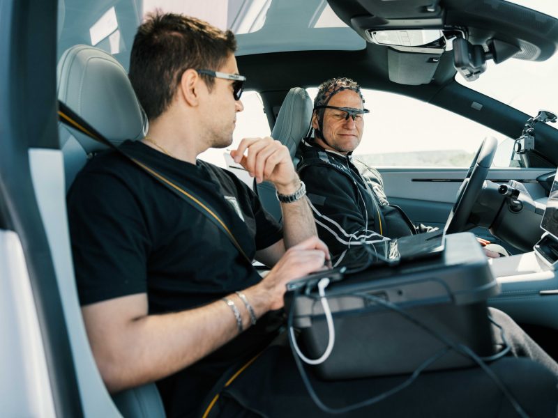 Oxford researcher monitoring telemetry and driver data from the passenger seat of a Polestar 4