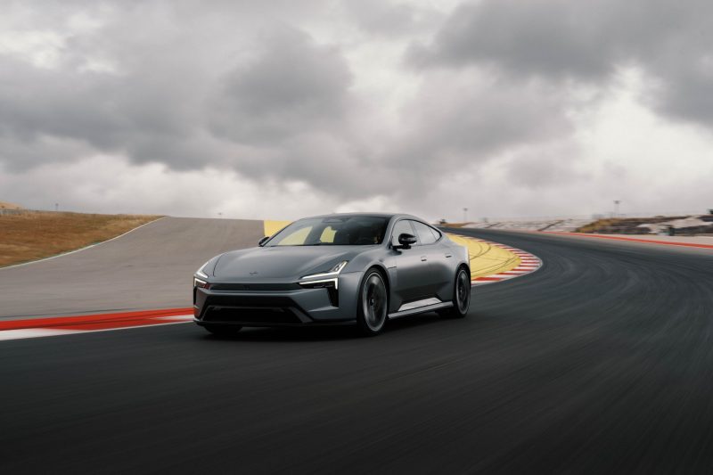 Polestar electric car cornering on a racetrack under cloudy skies