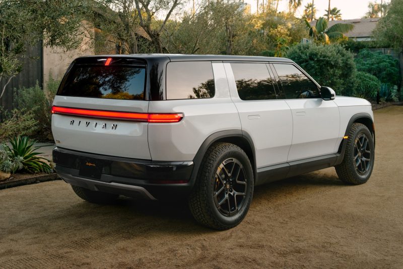 Rivian R2 in white, rear three-quarter view