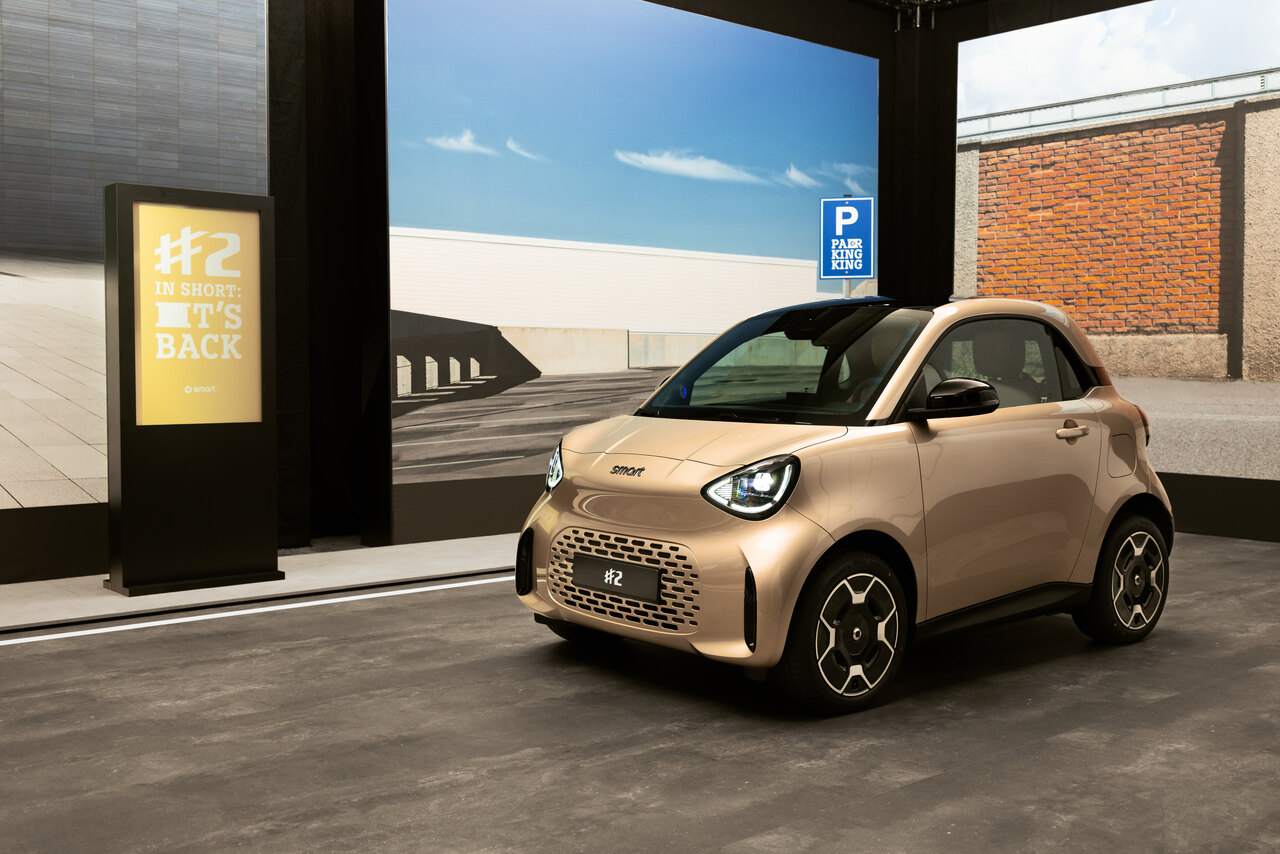 Smart #2 Premium in gold metallic, front three-quarter view