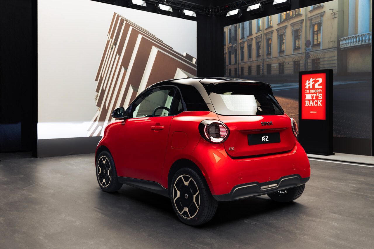Smart #2 Premium in Laser Red, rear three-quarter view showing the split tailgate
